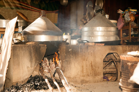 Pots cooking on a traditional adobe clay stove.