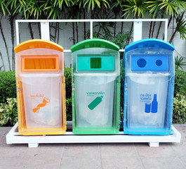 classify bins for recycle,Thai Language yellow is general waste,green is plastic bottle,blue is can and glass bottles...