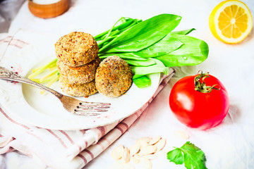 lentil cutlets with paprika and porridge, greens, tomato, vegan