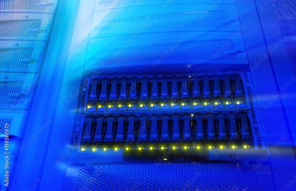 Poster rack with blade behind bars mainframe in the data center blur and motion