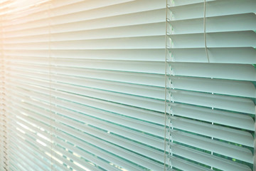 white Curtains blinds and orange light .