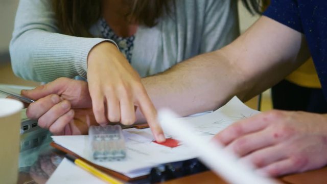  Close up of young student group working together in college