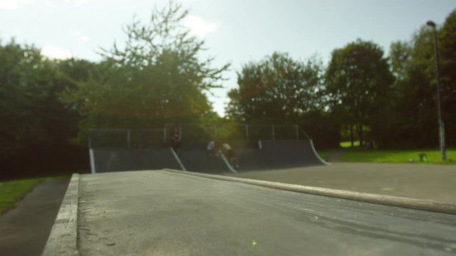  Young man practicing parkour jumps at the skate park