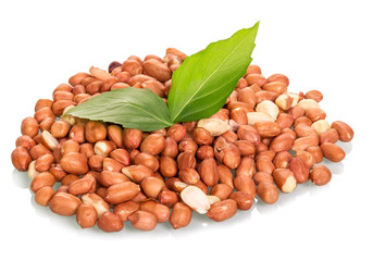 Handful of peanuts with a leaf closeup isolated on white backgro