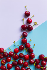 group of cherries on pastel color trendy background