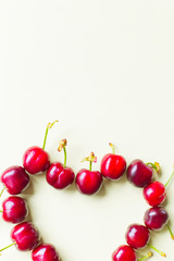 heart of cherries on clear background, minimal spring theme