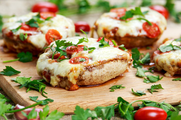 Cooked Mushrooms stuffed with cheese and plum tomatoes