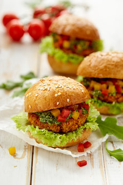 Vegetarian burger with lettuce, herb pesto and peppers