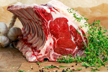Fresh Raw Beef bone rib roughly choppid. with herbs.