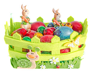 Colored romanian traditional Easter eggs in a basket with green grass, bunny, isolated