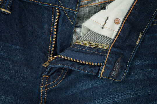 Closeup and open zipper blue jean