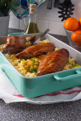 Baked spicy wings of turkey with cheese noodles.