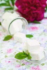 Fototapeta na wymiar White marshmallows in a glass jar