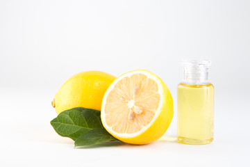 lemon essential oil and lemon fruit isolate on white background