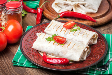 Fototapeta na wymiar Burritos filled wiht minced meat, bean and vegetables.