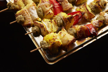 appetizer skewers the fish with vegetables, olives