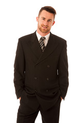 Successful businessman in formal suit confidently standing isola
