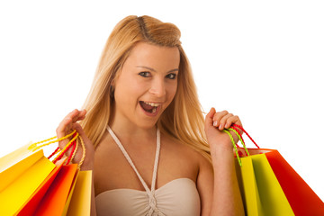 Cute blonde woman with shopping vibrant bags isolated over white