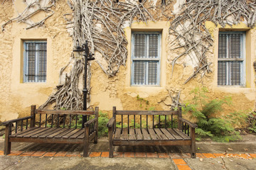 Fototapeta na wymiar Two bench and background with old house and tree on it