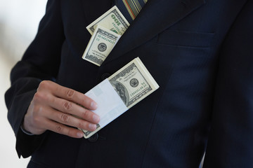money in the pocket of a businessman