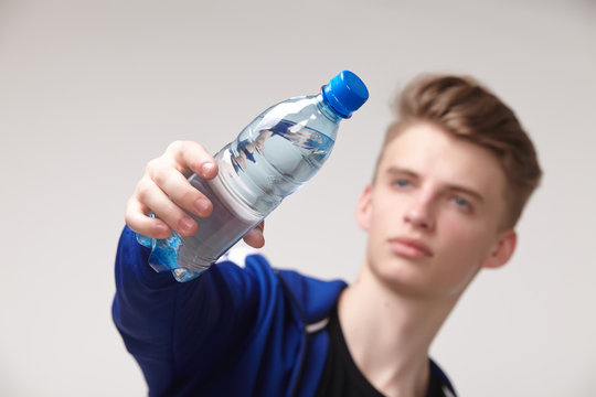 male athlete with water bottle