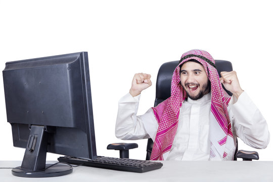 Cheerful Arabic businessman celebrate his success