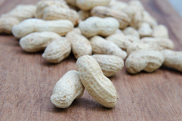 Close up Peanuts  on wood background