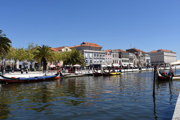 Fototapeta premium Waterway with boats in Aveiro, Beiras region, Portugal