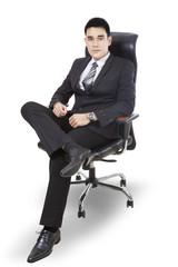 Handsome businessman sitting on chair