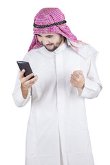 Happy Arabic entrepreneur reads message