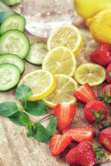 Fototapeta na wymiar Ingredients for infused detox fruit water