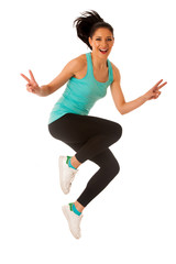 Happy fit and slim woman dancing and jumping isolated over white