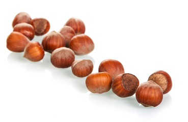 Raw hazelnuts close-up isolated on white