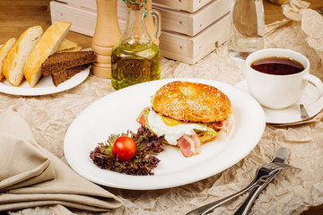 Burger in a white plate on table