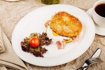 Burger in a white plate on table