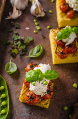 Grilled polenta with tomatoes