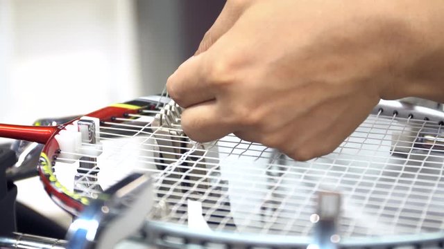 4K Stock footage of Man made weaving badminton racket, by auto machine