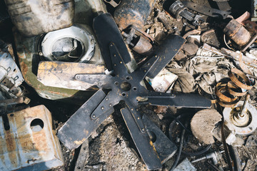A pile of debris in a workshop. Impeller. Radiator Cooling Fan.