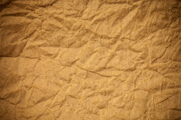 Brown crumpled eco paper background.