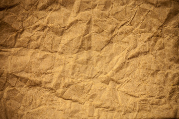 Brown crumpled eco paper background.