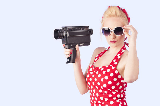 Pin up girl with vintage camera 8 mm 