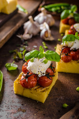 Grilled polenta with tomatoes