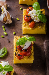Grilled polenta with tomatoes