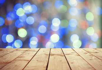 Wooden surface against bokeh background