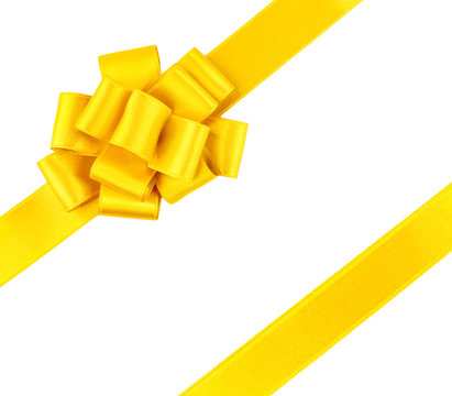 Yellow diagonal ribbons and bow, isolated on white