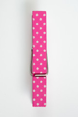 Fototapeta premium Pink Clothes Pin with Fun Patterns Top View