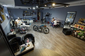 common frame tattoo parlor. Girls do the tattoo.