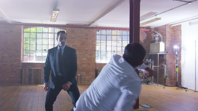  Handsome businessman or special agent character outnumbered in a fight 