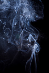 White smoke on a black background.