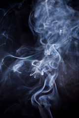 White smoke on black background.